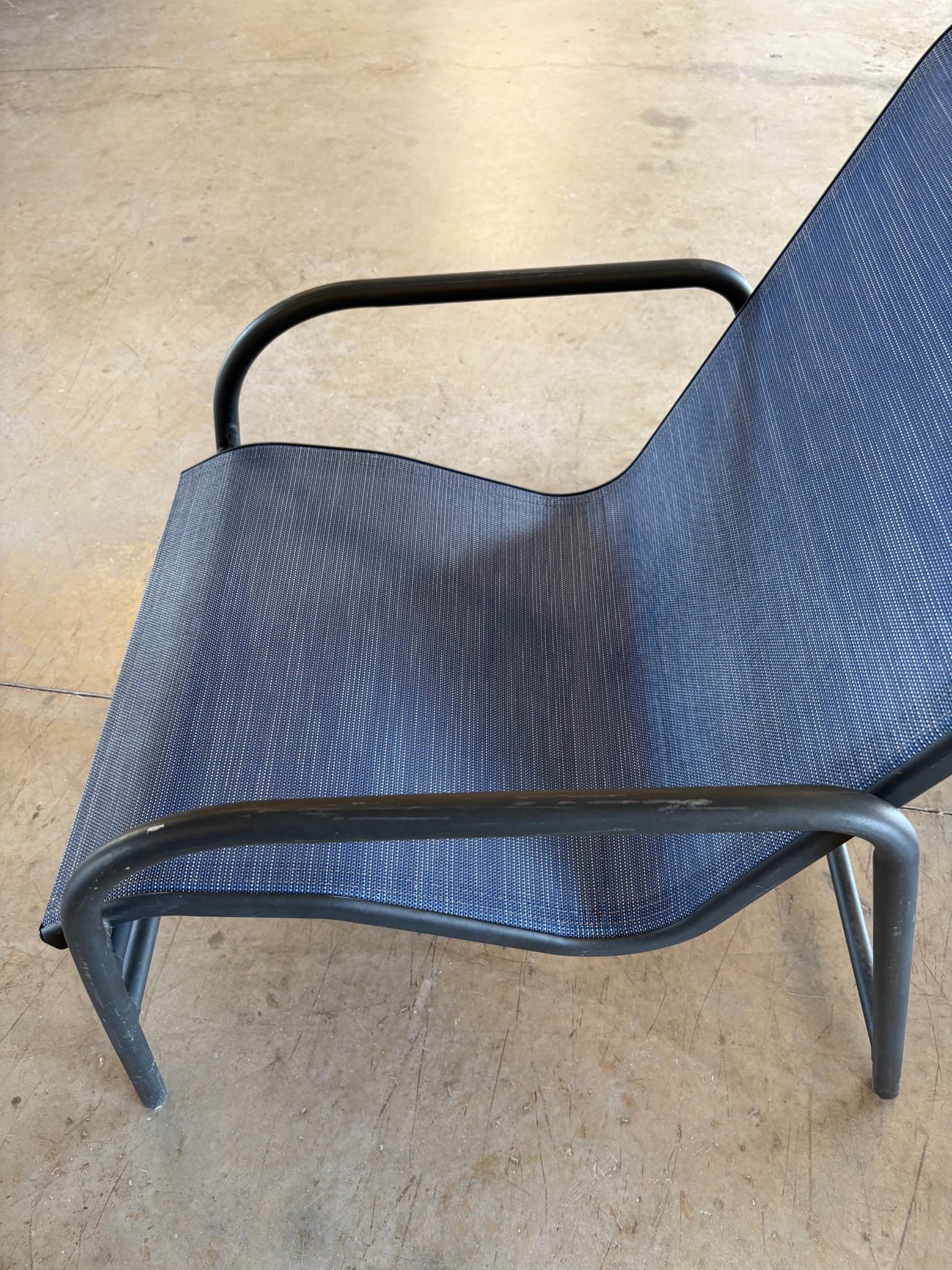 Restored outdoor sling chair with new navy fabric